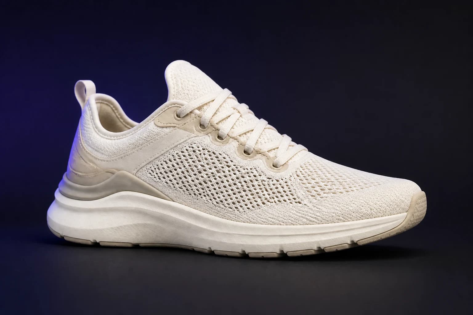 A detailed performance sneaker in a dark product-image demonstration